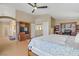Bedroom with ceiling fan, walk in closets, and an ensuite bathroom at 4012 Owlshead Mountain St, Las Vegas, NV 89129