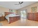 This bedroom boasts a spacious layout, a ceiling fan, and a private balcony at 4012 Owlshead Mountain St, Las Vegas, NV 89129