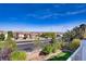 A bright view featuring a glimpse of green grass, trees, and blue sky at 4012 Owlshead Mountain St, Las Vegas, NV 89129