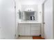 Bright bathroom featuring new vanity, modern mirror, and flooring at 4687 Monterey Cir # 1, Las Vegas, NV 89169