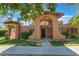 Exterior view of the home with desert landscaping, unique architectural details, and a welcoming entrance at 4687 Monterey Cir # 1, Las Vegas, NV 89169