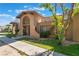 Lovely exterior view of the home featuring unique architectural details and mature trees at 4687 Monterey Cir # 1, Las Vegas, NV 89169