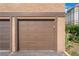 Garage door with a wood frame and concrete beneath for vehicle parking at 4687 Monterey Cir # 1, Las Vegas, NV 89169