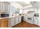 Well-lit kitchen featuring appliances and ample cabinetry at 4687 Monterey Cir # 1, Las Vegas, NV 89169