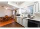 Open concept kitchen and dining area with natural light at 4687 Monterey Cir # 1, Las Vegas, NV 89169