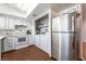 Functional kitchen with stainless steel refrigerator and laundry area at 4687 Monterey Cir # 1, Las Vegas, NV 89169