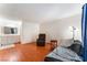 Cozy living room with a modern vanity in the bathroom and recliner at 4687 Monterey Cir # 1, Las Vegas, NV 89169