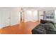 Open concept living room with wood floors and natural light at 4687 Monterey Cir # 1, Las Vegas, NV 89169