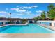 Beautiful community swimming pool with blue and white accents on building in the background at 4687 Monterey Cir # 1, Las Vegas, NV 89169