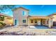 View of the back exterior of the home with a covered patio and rock landscaping at 524 Blanche Ct, Henderson, NV 89052