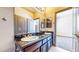 Bathroom featuring double sinks, granite countertops, and modern fixtures at 524 Blanche Ct, Henderson, NV 89052