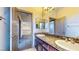 Bathroom with granite counter tops, double sinks, and decorative mirrors at 524 Blanche Ct, Henderson, NV 89052