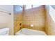 Tiled shower and tub with window; well-maintained bathroom at 524 Blanche Ct, Henderson, NV 89052