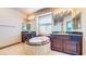 Bathroom showcasing dual vanities and a stylish soaking tub at 524 Blanche Ct, Henderson, NV 89052
