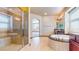 Bathroom featuring a walk-in shower, soaking tub and dual vanities at 524 Blanche Ct, Henderson, NV 89052