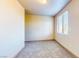 Bedroom with neutral walls, plush carpeting, and a bright window at 524 Blanche Ct, Henderson, NV 89052