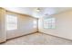 Bright bedroom featuring three windows for ample natural light and neutral carpeting at 524 Blanche Ct, Henderson, NV 89052