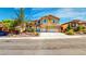 Charming two-story home with attached two car garage and landscaped front yard at 524 Blanche Ct, Henderson, NV 89052