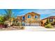 Charming two-story home with attached two car garage and landscaped front yard at 524 Blanche Ct, Henderson, NV 89052