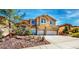 Charming two-story home with attached two car garage and landscaped front yard at 524 Blanche Ct, Henderson, NV 89052