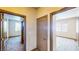 Hallway with doorways leading to bedrooms, carpeted floors, and neutral walls at 524 Blanche Ct, Henderson, NV 89052