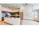 Well-lit kitchen with stainless steel appliances, dark wood cabinets, and tiled floors at 524 Blanche Ct, Henderson, NV 89052