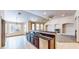 Open kitchen area with breakfast bar, granite countertops, and stainless steel appliances at 524 Blanche Ct, Henderson, NV 89052