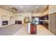Open kitchen featuring dark wood cabinets, granite countertops, and stainless steel appliances at 524 Blanche Ct, Henderson, NV 89052