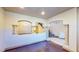 Open living area with hardwood floors, decorative columns, and arched openings at 524 Blanche Ct, Henderson, NV 89052