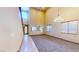 Bright living room with large windows, high ceilings, and neutral carpet at 524 Blanche Ct, Henderson, NV 89052