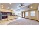 Open-concept living area featuring tile floors, breakfast bar and natural light at 524 Blanche Ct, Henderson, NV 89052