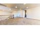 Open loft space with carpet flooring, decorative railing, and ample natural light at 524 Blanche Ct, Henderson, NV 89052