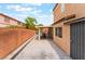 A backyard patio features a covered seating area and secure gate access, perfect for outdoor living at 601 Bear Grass St, Las Vegas, NV 89144