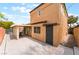 The backyard patio features concrete flooring and a covered seating area, perfect for outdoor relaxation and entertainment at 601 Bear Grass St, Las Vegas, NV 89144
