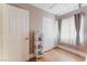 Bedroom featuring hardwood floors, large closet, and modern sheer curtains with color accents at 601 Bear Grass St, Las Vegas, NV 89144