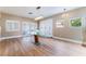 Dining room featuring wood flooring, modern lighting, and minimalist decor at 601 Bear Grass St, Las Vegas, NV 89144