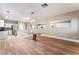 Open floorplan with dining area featuring modern table and access to kitchen at 601 Bear Grass St, Las Vegas, NV 89144