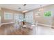 Spacious dining room with a modern glass table, stylish chairs, and contemporary lighting at 601 Bear Grass St, Las Vegas, NV 89144