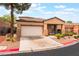 Charming single-story home featuring a two-car garage and desert landscaping at 601 Bear Grass St, Las Vegas, NV 89144