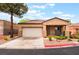 Charming single-story home featuring a two-car garage and desert landscaping at 601 Bear Grass St, Las Vegas, NV 89144