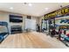 Spacious workout area with modern exercise equipment, TV and white board in converted garage at 601 Bear Grass St, Las Vegas, NV 89144