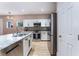 Bright kitchen featuring stainless steel appliances, white cabinets, and modern sink at 601 Bear Grass St, Las Vegas, NV 89144