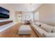 Stylish living room boasts an open floor plan, hardwood floors, and ample natural light. Dining area present at 601 Bear Grass St, Las Vegas, NV 89144