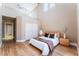 Spacious main bedroom with an upstairs loft view, closet, and sliding doors at 601 Bear Grass St, Las Vegas, NV 89144