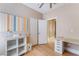 Versatile office space with built-in desk, ample storage, and neutral tones, creating a productive environment at 601 Bear Grass St, Las Vegas, NV 89144