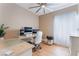 Bright office featuring wood floors, desk, ceiling fan, and natural light from the window at 601 Bear Grass St, Las Vegas, NV 89144