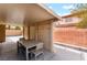 Covered patio with stylish outdoor dining table and seating, perfect for entertaining at 601 Bear Grass St, Las Vegas, NV 89144