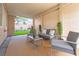 Inviting covered patio with stylish furniture and a view of the green lawn at 601 Bear Grass St, Las Vegas, NV 89144