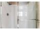 Clean, tiled shower enclosure with glass doors and modern fixtures, perfect for a refreshing experience at 601 Bear Grass St, Las Vegas, NV 89144