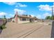 Spacious backyard with a low-maintenance gravel landscape and a charming single-story home at 608 W Mcdermit St, Las Vegas, NV 89107